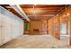 Unfinished basement featuring a brick fireplace and natural light at 720 Belgrave Ln, Tucker, GA 30084