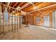 Unfinished basement with exposed wood framework and concrete floors at 720 Belgrave Ln, Tucker, GA 30084