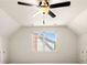 Bright bedroom featuring a ceiling fan and large windows with views of the neighborhood at 720 Belgrave Ln, Tucker, GA 30084