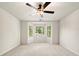 Bright bedroom featuring a ceiling fan and a bay window that offers ample natural light at 720 Belgrave Ln, Tucker, GA 30084