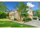Well-maintained home exterior showcasing the siding, roof, and mature landscaping at 720 Belgrave Ln, Tucker, GA 30084