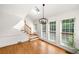 Foyer featuring hardwood floors, stairs leading to the second floor, and natural light streaming in through multiple windows at 720 Belgrave Ln, Tucker, GA 30084