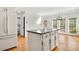 Spacious kitchen island with seating, offering a view of the sunny breakfast nook and backyard, great for entertaining at 720 Belgrave Ln, Tucker, GA 30084