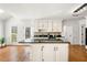 Functional kitchen island with storage, granite countertop, and open layout, perfect for food preparation at 720 Belgrave Ln, Tucker, GA 30084