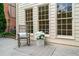Cozy patio with rocking chair, rug, and plants at 720 Belgrave Ln, Tucker, GA 30084