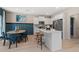 Bright kitchen with stainless steel appliances, white cabinets, and a breakfast bar at 112 Alpine Rd, Fairburn, GA 30213