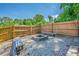 Backyard fire pit area with gravel, wooden benches, and privacy fence at 2133 Bird Ln, Snellville, GA 30078
