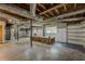Unfinished basement with concrete floors, exposed ductwork, and a workbench at 2133 Bird Ln, Snellville, GA 30078
