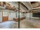 Unfinished basement with wooden workbench and storage shelves at 2133 Bird Ln, Snellville, GA 30078