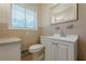 Functional bathroom featuring sink with vanity and neutral tiling and fixtures at 2133 Bird Ln, Snellville, GA 30078