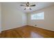 Cozy bedroom featuring hardwood floors, a closet, and easy access to the upper floor at 2133 Bird Ln, Snellville, GA 30078