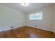 Clean bedroom showcasing hardwood flooring and a window at 2133 Bird Ln, Snellville, GA 30078
