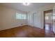 Spacious bedroom featuring hardwood flooring, a window and two closets at 2133 Bird Ln, Snellville, GA 30078