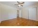 Bedroom featuring hardwood floors, a closet, and access to the hallway at 2133 Bird Ln, Snellville, GA 30078