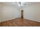 Bedroom featuring hardwood floors, a closet, and easy access to the upper floor at 2133 Bird Ln, Snellville, GA 30078
