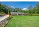 Charming single-story brick home with a beautifully landscaped front yard and a long driveway at 2133 Bird Ln, Snellville, GA 30078