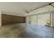 Garage featuring brick wall, concrete block ventilation and a roll up garage door at 2133 Bird Ln, Snellville, GA 30078