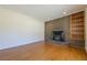 Spacious living room with a brick fireplace and built-in shelving, blending charm with functionality for cozy living at 2133 Bird Ln, Snellville, GA 30078