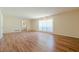 Bright and spacious living room with hardwood floors, a large window, and easy access to other rooms at 2133 Bird Ln, Snellville, GA 30078