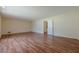 Expansive living room with wood floors, neutral walls, and recessed lighting, offering a versatile and inviting space at 2133 Bird Ln, Snellville, GA 30078
