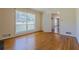 Bright living room with a large window and classic hardwood floors, creating a warm and inviting atmosphere at 2133 Bird Ln, Snellville, GA 30078