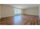 Open living room featuring modern flooring and ample natural light, creating a welcoming and airy atmosphere at 2133 Bird Ln, Snellville, GA 30078