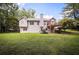 Spacious backyard with mature trees and a well-maintained lawn at 239 Clear Brook Trl, Douglasville, GA 30134
