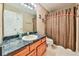 Bathroom featuring a single sink vanity with a dark countertop and a shower with a curtain at 239 Clear Brook Trl, Douglasville, GA 30134