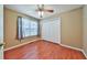 Cozy bedroom with hardwood floors, neutral walls, a ceiling fan, and a double-door closet at 239 Clear Brook Trl, Douglasville, GA 30134
