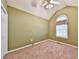 Neutral bedroom with a vaulted ceiling, fan, window, closet, and carpeted floor at 239 Clear Brook Trl, Douglasville, GA 30134