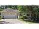 Charming home featuring an attached two car garage, traditional curb appeal, and a well-manicured lawn at 239 Clear Brook Trl, Douglasville, GA 30134
