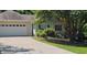 Charming home featuring an attached two car garage, traditional curb appeal, and a well-manicured lawn at 239 Clear Brook Trl, Douglasville, GA 30134