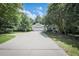 Beautiful single-story home featuring an attached garage, a long driveway, and mature trees at 239 Clear Brook Trl, Douglasville, GA 30134