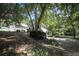 Single-story house with well-maintained landscaping, garage, and long driveway at 239 Clear Brook Trl, Douglasville, GA 30134
