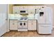 Functional kitchen features white appliances and ample counter space at 239 Clear Brook Trl, Douglasville, GA 30134