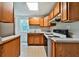 Functional kitchen with wood cabinets and essential appliances, providing a canvas for culinary creativity at 239 Clear Brook Trl, Douglasville, GA 30134