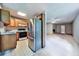 Open kitchen with access to the living room and featuring wood cabinets that offers possibilities for renovation at 239 Clear Brook Trl, Douglasville, GA 30134