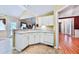 Corner view of the kitchen with ample cabinets and access to the living room at 239 Clear Brook Trl, Douglasville, GA 30134