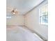 Bright living room with a drop ceiling with a large window, offering an opportunity for renovation at 239 Clear Brook Trl, Douglasville, GA 30134