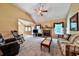 Bright living room with vaulted ceiling, stone fireplace, and access to the backyard at 239 Clear Brook Trl, Douglasville, GA 30134