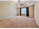 Large main bedroom featuring a trey ceiling, carpeted floor, and a large window at 239 Clear Brook Trl, Douglasville, GA 30134