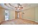 Large main bedroom featuring a trey ceiling, carpeted floor, and access to a bathroom at 239 Clear Brook Trl, Douglasville, GA 30134