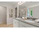 Bathroom features a double sink vanity with grey counters and modern fixtures at 35 Cedar Dr, Fairburn, GA 30213