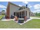 Backyard patio featuring a fire pit and comfortable seating providing a relaxing outdoor entertainment area at 4100 Secret Shoals Way, Buford, GA 30518
