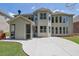 Expansive backyard featuring a concrete patio and lush lawn, great for entertaining at 4100 Secret Shoals Way, Buford, GA 30518