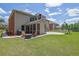 Spacious backyard featuring a screened porch, outdoor fireplace and basketball hoop at 4100 Secret Shoals Way, Buford, GA 30518