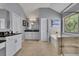 Elegant bathroom featuring a soaking tub, glass-enclosed shower, and double vanity sinks at 4100 Secret Shoals Way, Buford, GA 30518