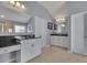 Bathroom with granite countertops, dual sinks, ample cabinet space, and neutral-colored tile flooring at 4100 Secret Shoals Way, Buford, GA 30518