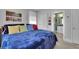 Comfortable bedroom featuring colorful pillows and art, with an ensuite bathroom providing convenience at 4100 Secret Shoals Way, Buford, GA 30518