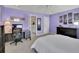 Spacious bedroom featuring purple walls, carpeted floors, and lots of natural light at 4100 Secret Shoals Way, Buford, GA 30518